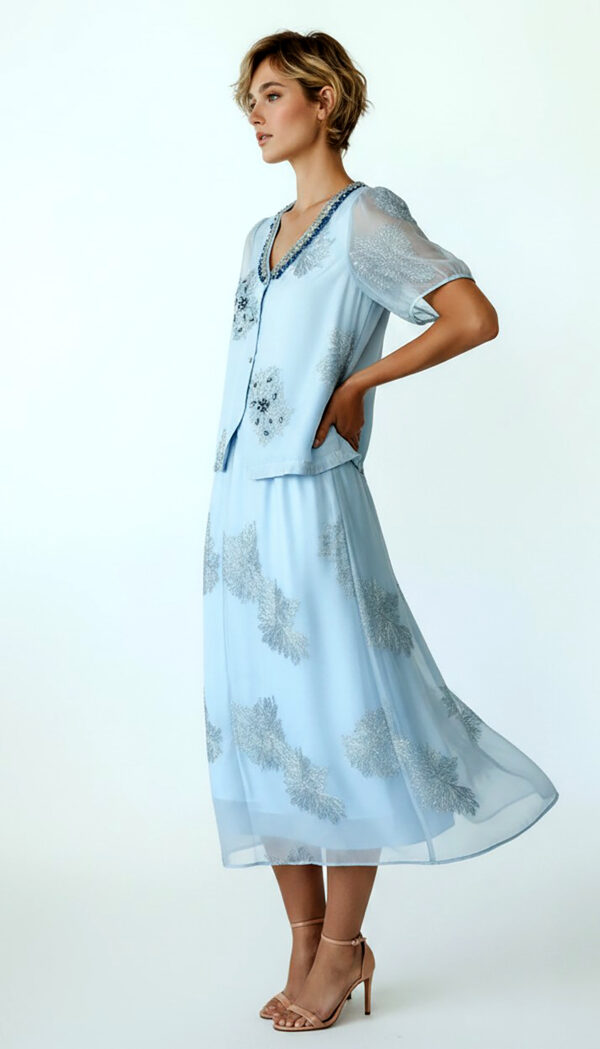 Hellblaues Oversize Damen Blusen Rock Set mit Strass Großhandel (10) Hellblaues Oversize Damen Blusen Rock Set mit Strass und transparenten Ärmeln