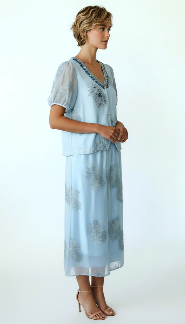 Hellblaues Oversize Damen Blusen Rock Set mit Strass Großhandel (7) Hellblaues Oversize Damen Blusen Rock Set mit Strass und transparenten Ärmeln